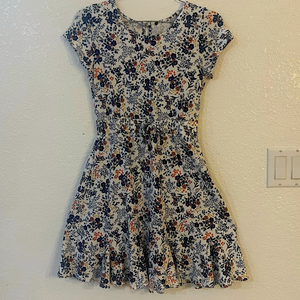 Soft feminine springtime dress. White with blue flowers. size 10/12.